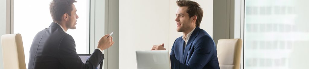 businessmen talking about beneficial ownership